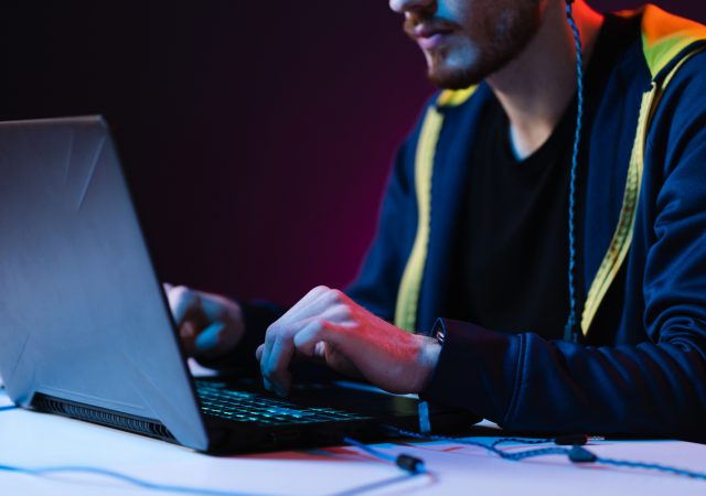 640703c5722f32f73816b88c gamer playing video games with headphones on neon 2021 09 04 14 58 38 utc 1
