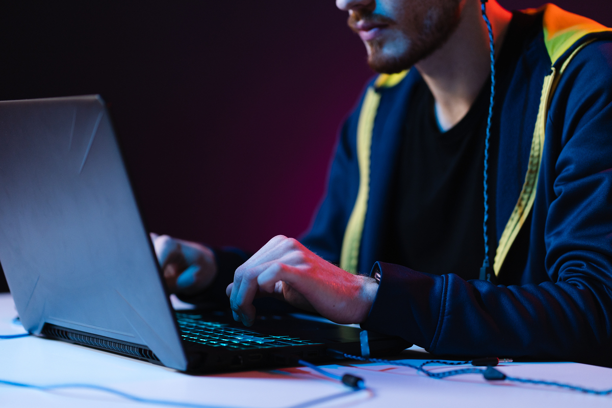 640703c5722f32f73816b88c gamer playing video games with headphones on neon 2021 09 04 14 58 38 utc 1